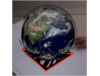 Deomnstration of Fraunhofer&#039;s Augmented Reality system showing a virtual Earth globe on a marker. The system tracks the movement of the marker.